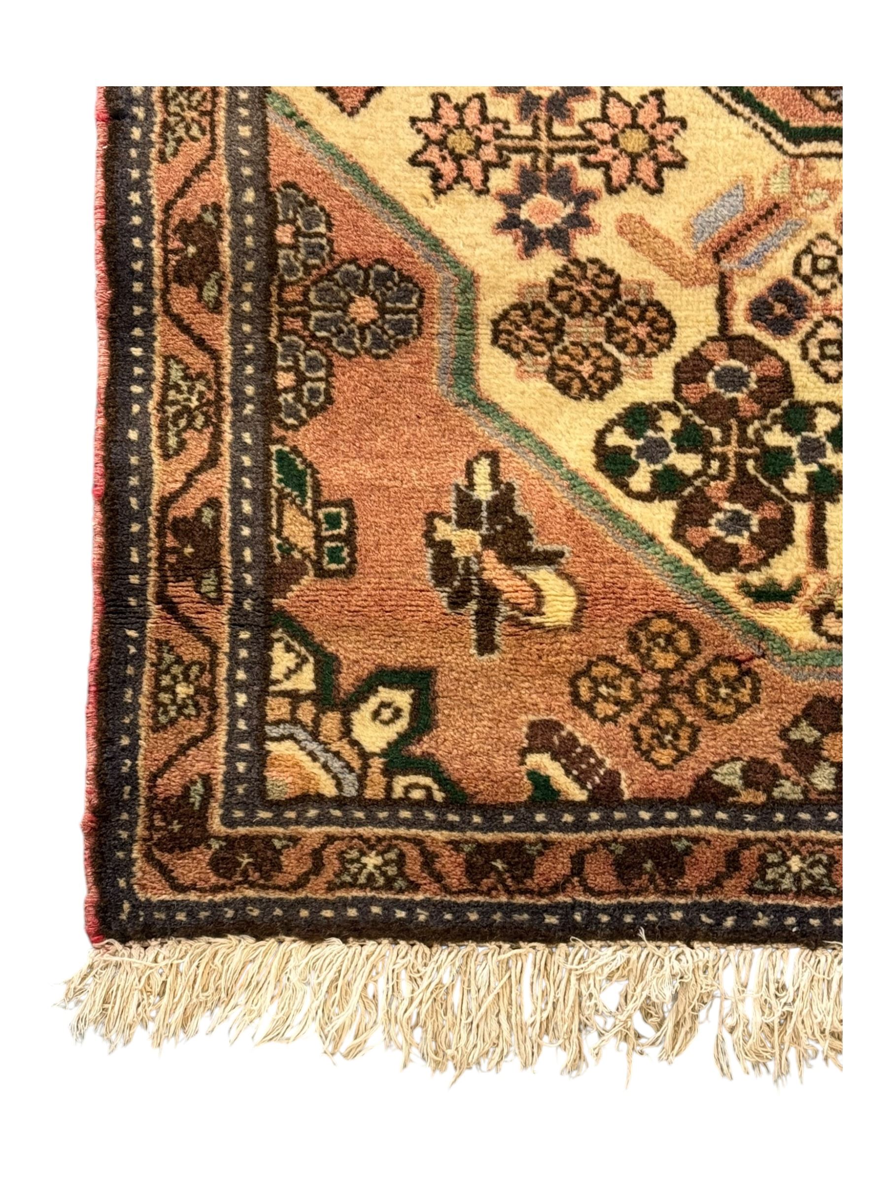 Persian design ivory ground rug, pale rose floral medallion with surrounding foliate decoration