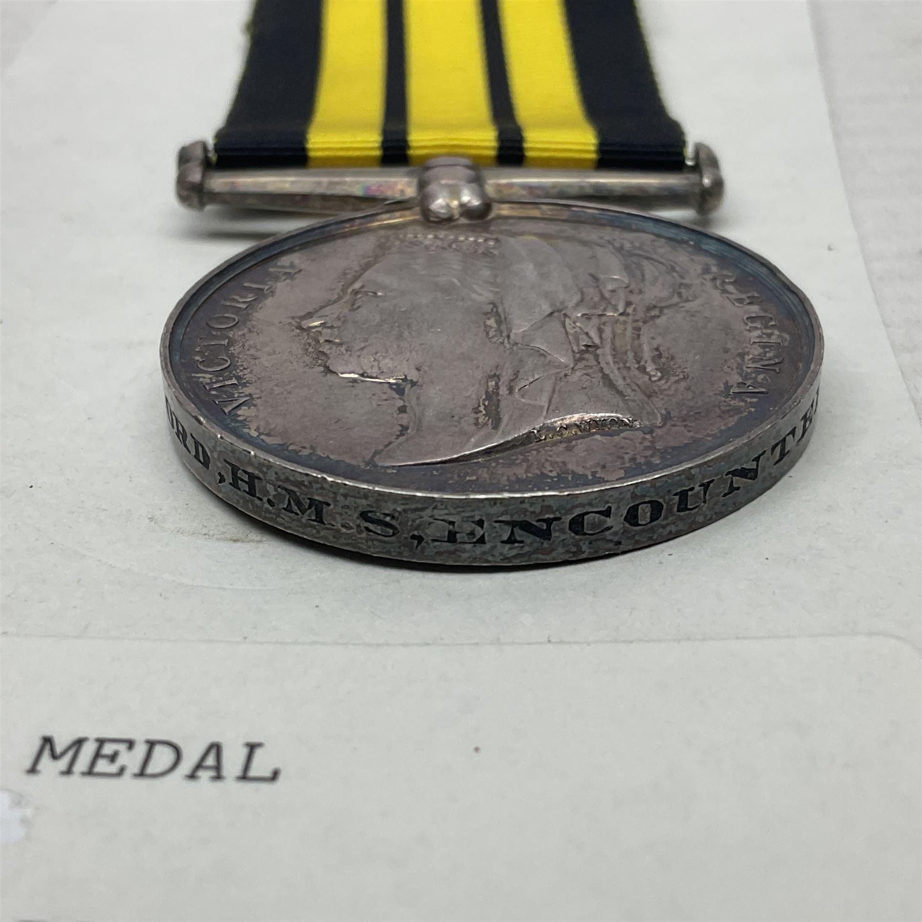 Victoria Ashantee Medal 1887-1900 awarded to W. Gray Ord. H.M.S. Encounter 73-74; with replacement ribbon but original present.