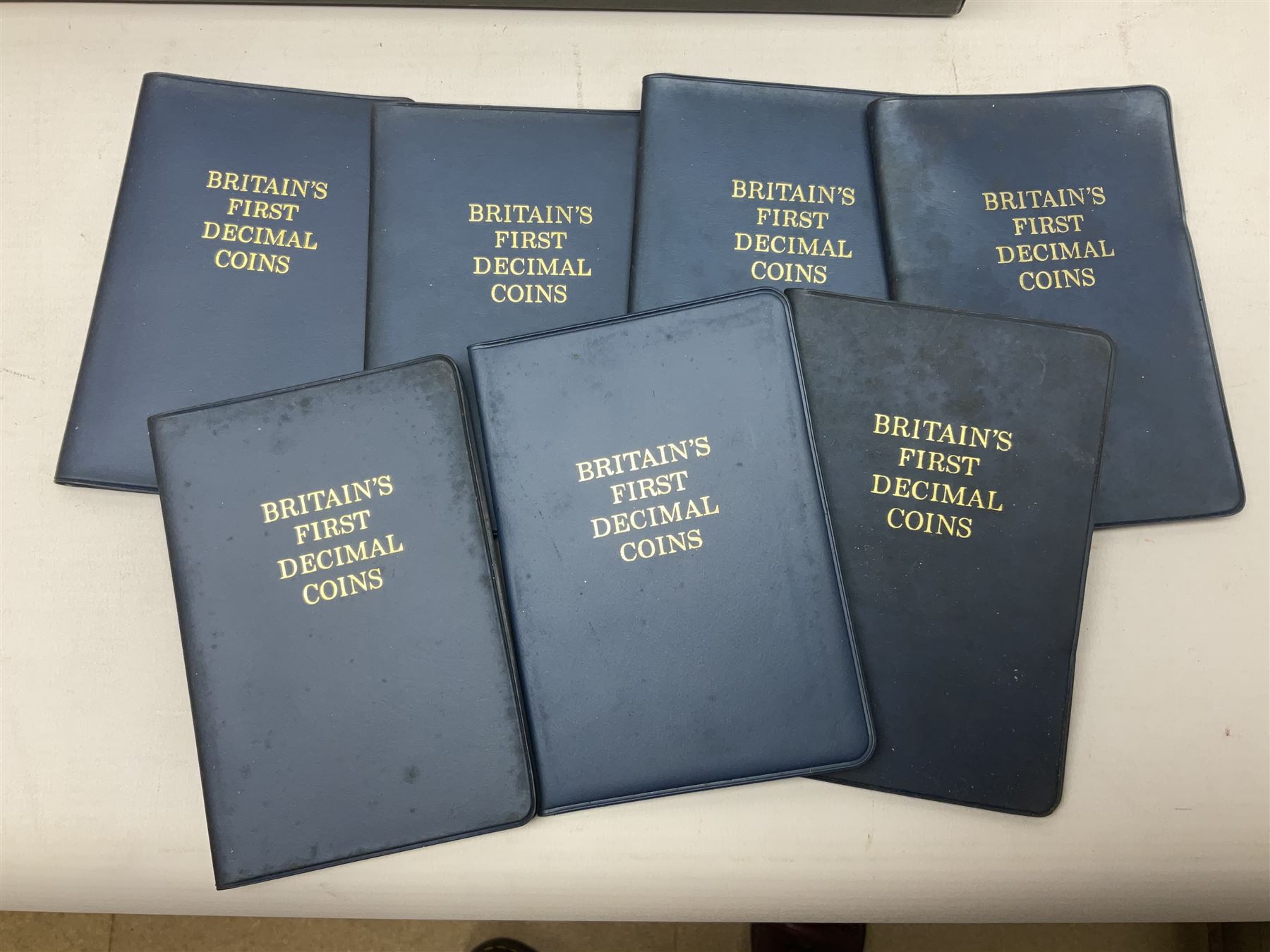 Great British and World coins and banknotes, including pre-decimal coinage, Britain's first decimal coins sets in blue folders, silver one yen coin converted into a brooch, commemorative crowns etc