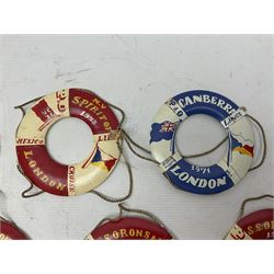 Thirteen P&O model life rings, referencing cargo and passenger ships, to include M.V Cannahore, Canberra, S.S Orsova, M,V Strathconon etc, D14cm