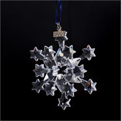 Nine Swarovski crystal snowflake Christmas ornaments, comprising years 1999-2005, 2010 and 2011, some with certificates, boxed (9)