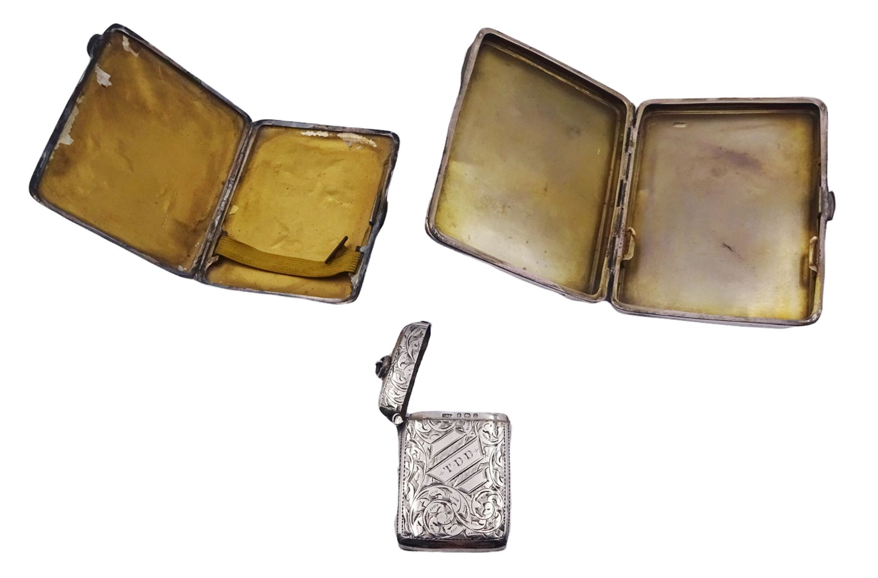1930's silver cigarette case, hallmarked Mayes, Mills & Co, Birmingham 1938, and an early 20th century silver cigarette case, hallmarked Birmingham 1919, makers mark worn and indistinct, both with engine turned decoration, together with a late Victorian silver vesta case with engraved initials and foliate scroll decoration, hallmarked William Vale & Sons, Birmingham 1900, approximate total weight 6.68 ozt (208 grams)