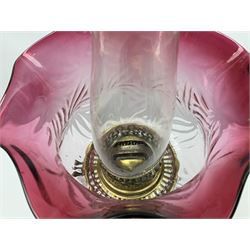 20th century Hawksworth, Eyre & Co silver plated oil lamp, the octagonal stepped base with engraved dedication, leading to an octagonal column supporting a faceted clear glass reservoir, Hinks Duplex burner, clear glass chimney, and cranberry glass shade, overall H71.5cm