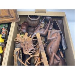 Collection of carved wooden items, to include wall hanging busts, wooden panels, animals, wooden panels, etc, in four boxes 