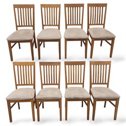 Contemporary solid oak rectangular dining table, with two additional extension leaves, together with eight matching high back dining chairs upholstered in cream suede-effect fabric (9) (Chair H 95cm, W 41cm, D 53cm) (Extends to 270cm)