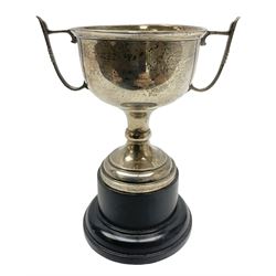 1930's silver twin handled trophy cup, upon black circular plinth, hallmarked Birmingham 1936, approximate silver weight 47 grams