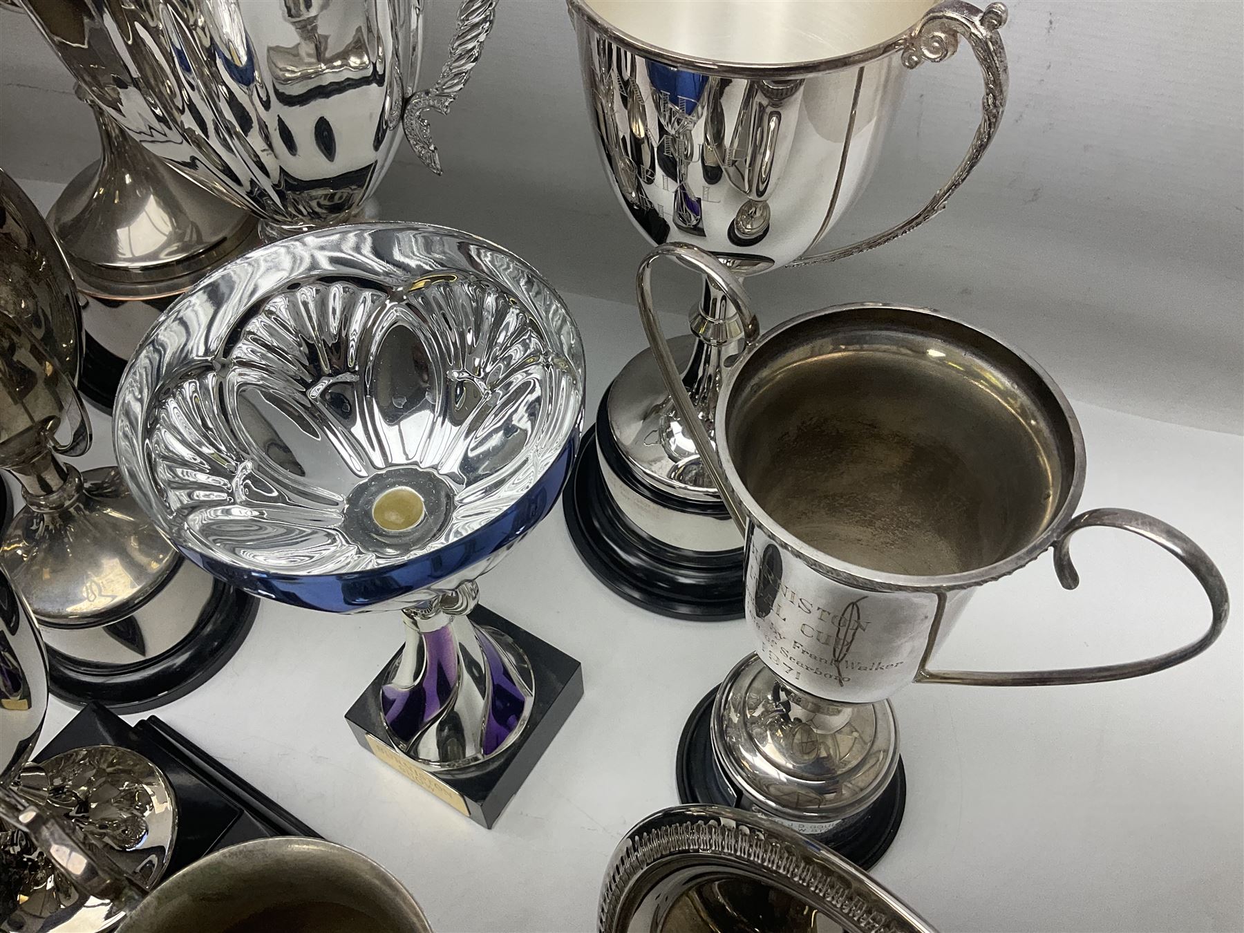Collection of silver plated and metal trophy cups and winners plaques, all relating to the Burniston and District Show, most engraved with competitions and winner's names, in three boxes 