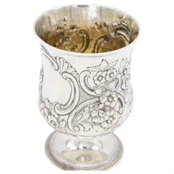 George III silver cup of circular form, embossed with scrolling and floral decoration, upon circular foot, hallmarked John Denzilow, London 1784, H13cm