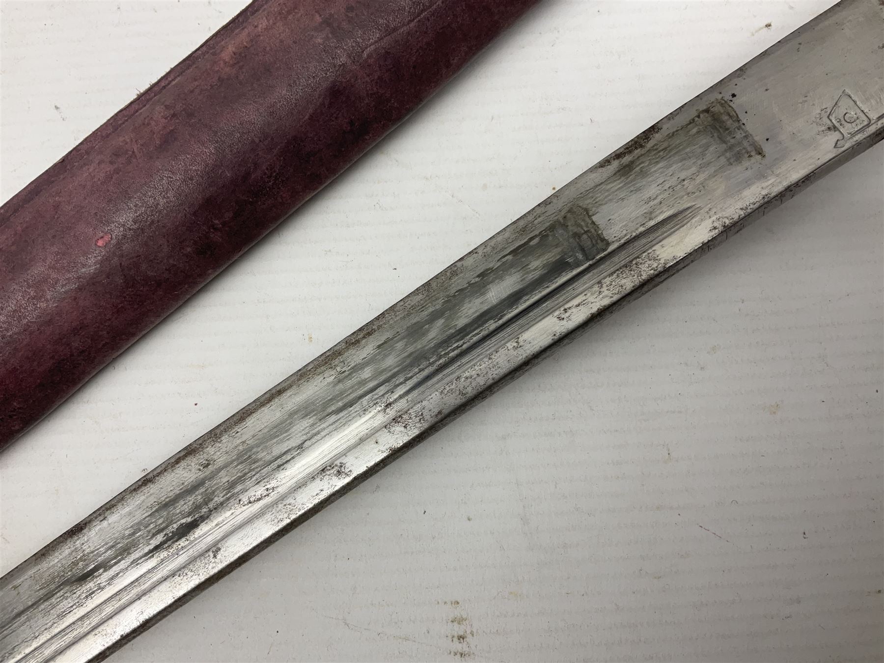 Copy of a WWII Japanese NCO sword, the 65cm slightly curving blade stamped with pseudo Japanese characters and cast brass simulated cord bound grip; in officer's leather bound field scabbard L97cm overall