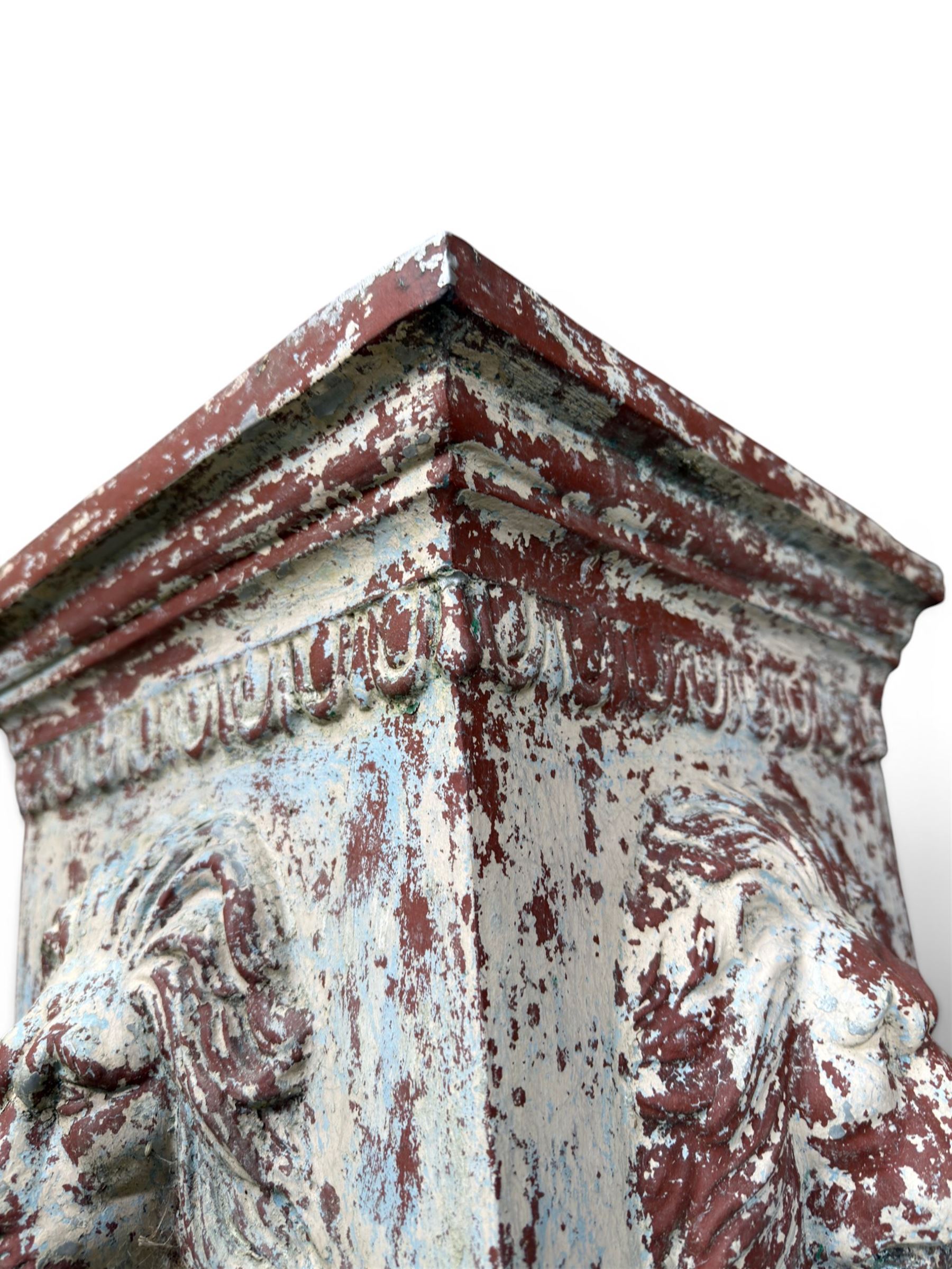 Early 20th century terracotta pedestal, square form with egg and dart detail, four lions masks to either side, finished in distressed cream paint
