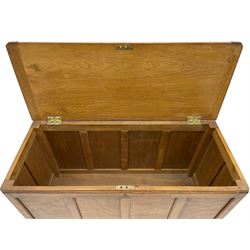'Mouseman' oak blanket box, hinged adzed top, all round panelling, raised on castors, relief carved inset mouse signature, by Robert Thompson of Kilburn