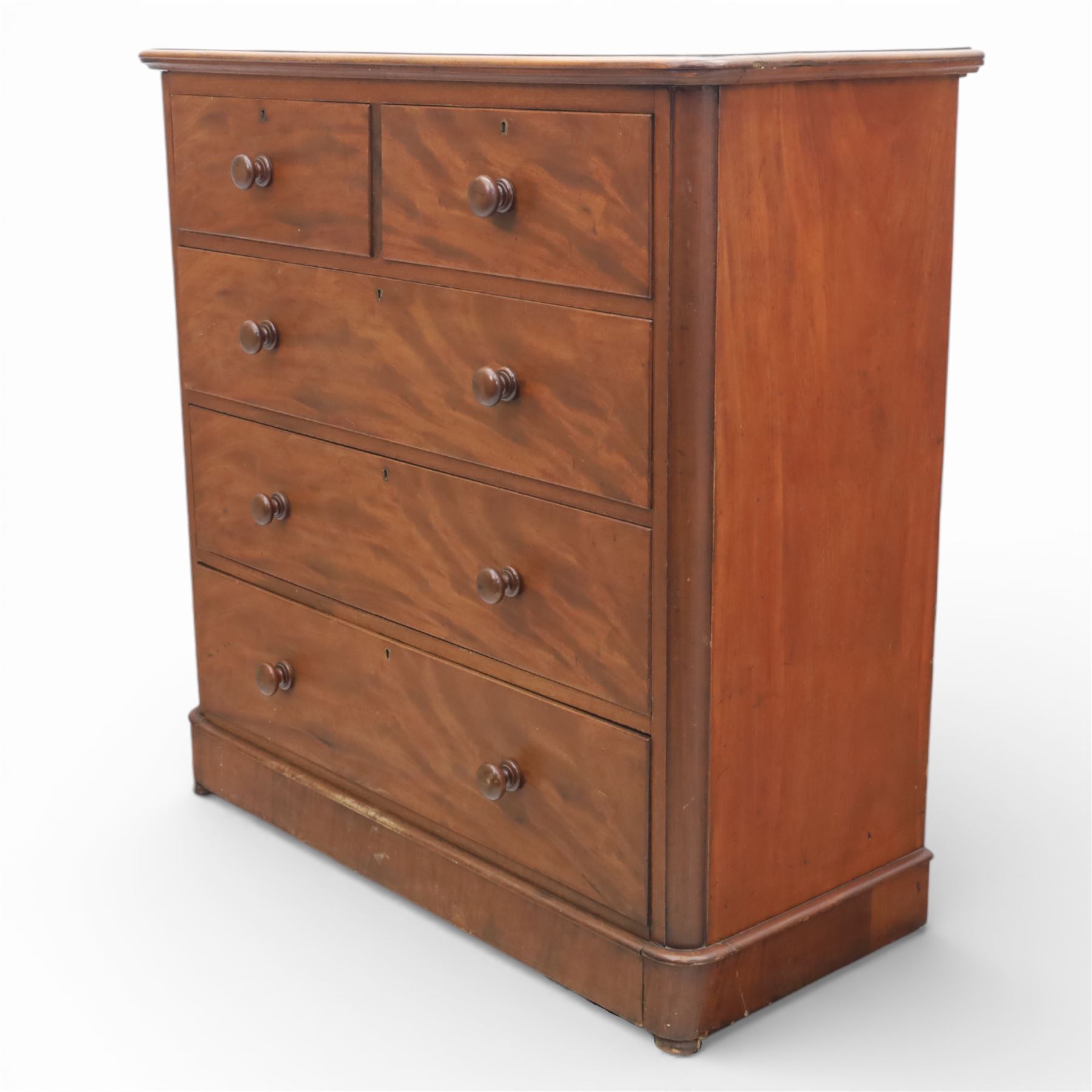 Mid Victorian flame mahogany chest of drawers, the moulded bow front top over two short and three long graduated drawers, fitted with turned wooden knob handles, flanked by rounded front corners continuing to plain sides, raised on a plinth base