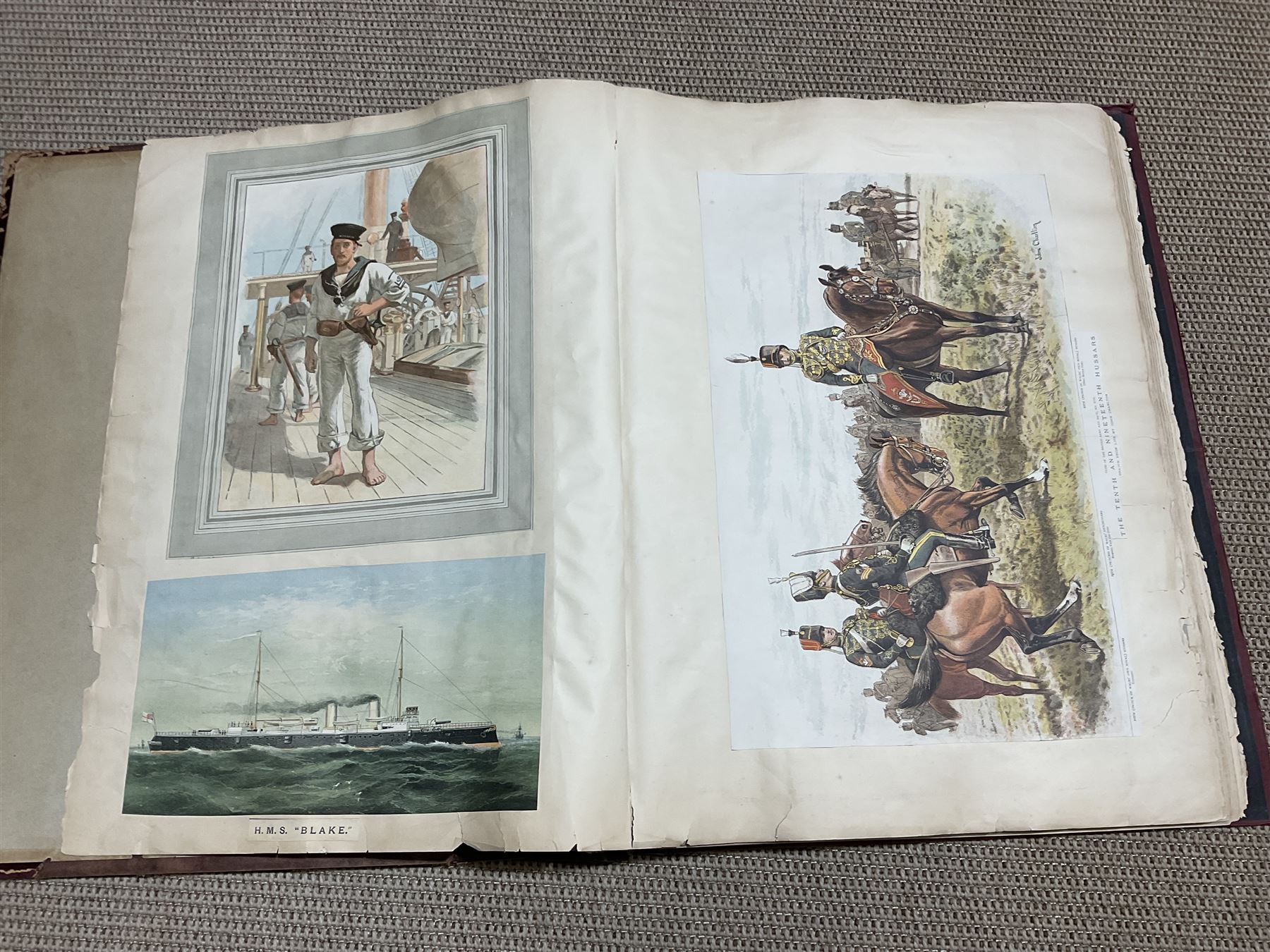 Large album of 19th century and later engravings and prints, mostly military, stuck down, album 49cm x 62cm overall