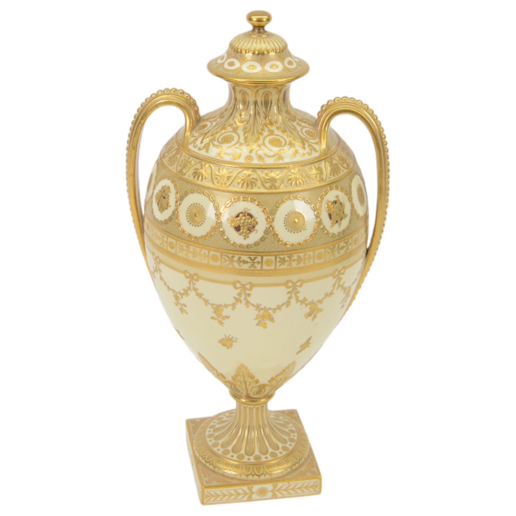 Royal Crown Derby twin handled vase and cover, circa 1886, decorated with raised and tooled gilt borders of foliate scrolls and husk swags upon a cream ground, H38cm