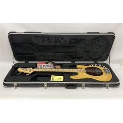 Ernie Ball Music Man Sting Ray 4 string bass guitar, in natural finish with roasted maple neck and tortoiseshell effect scratch guard, serial no 87485, in black Music Man hard case, guitar L114cm