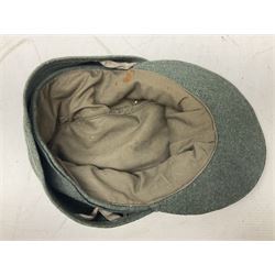 WW2 German Army M43 field cap with triangular cloth eagle and roundel badge and metal edelweiss badge for mountain troops; faintly stamped '5 VMF(?)'