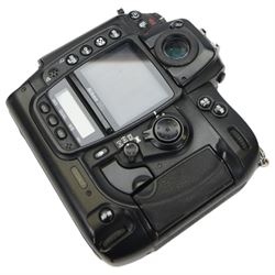 Nikon D2x digital SLR camera body, serial no. 5020627, with some associated battery packs and accessories