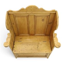 Victorian waxed pine settle or hall bench, shaped cresting rail over double panelled back, outswept arms on hinged box-seat, on end supports