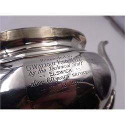 1920s silver teapot, of oval faceted form, with Bakelite type handle and finial, with presentation engraving to body, and upon four paw feet, hallmarked Northern Goldsmiths Co, Birmingham 1929, H16cm