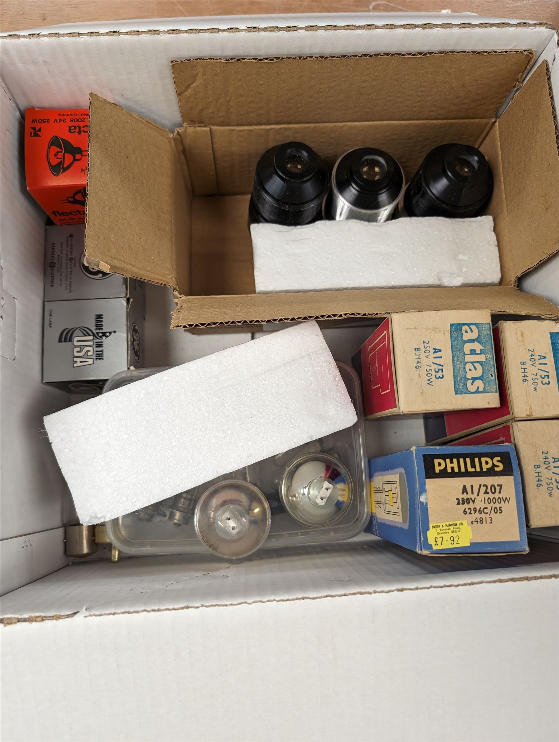 Bell & Howell TQ III 16mm film projector, together with lenses and spare projector lamps and a quantity of 16mm film reels, including Kellogg advert, Tex Avery cartoon and other film reels
