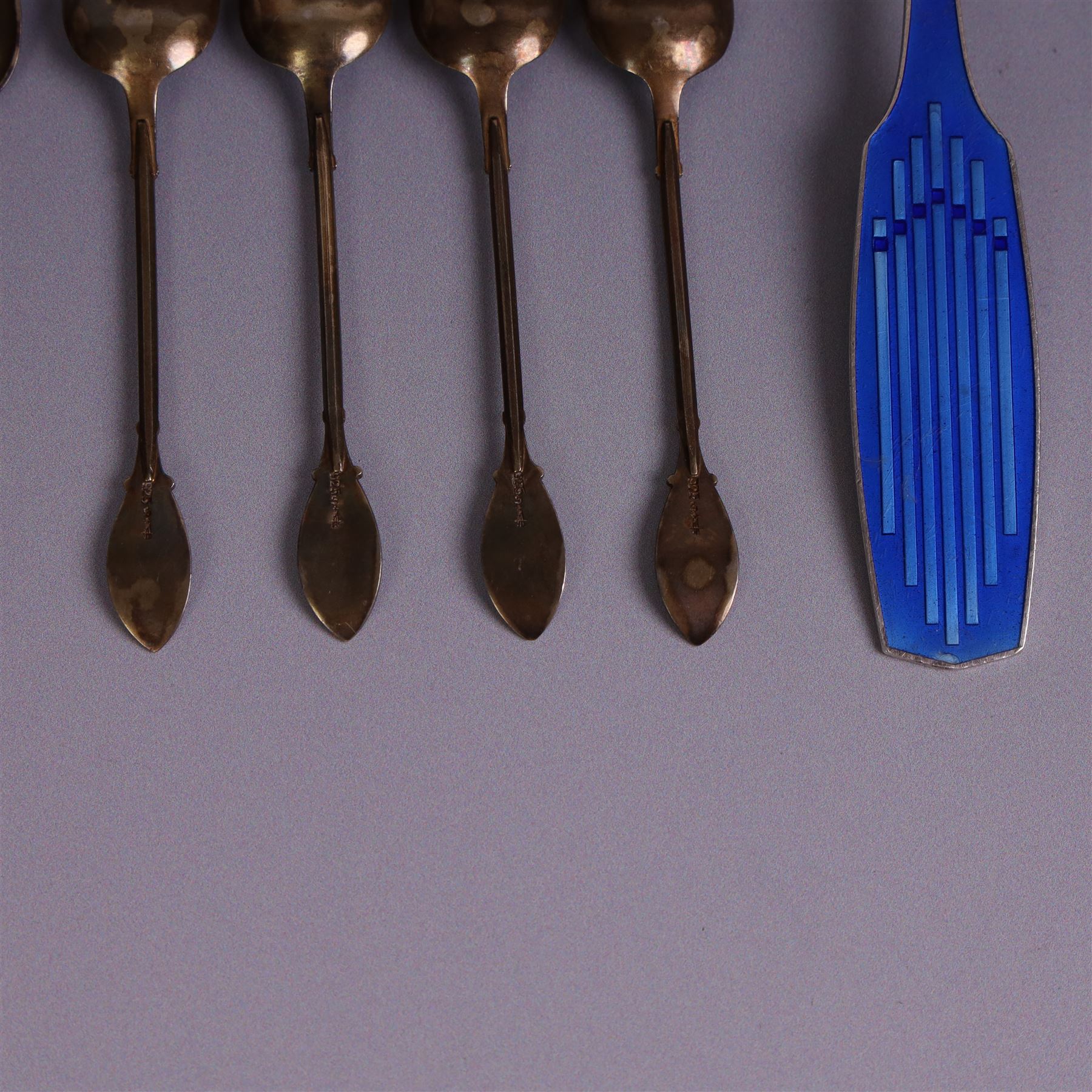Collection of continental silver spoons, including set of six enamel demitasse spoons, stamped 925 and two enamel year spoons one by Arne Hansen, the other by Anton Michelsen