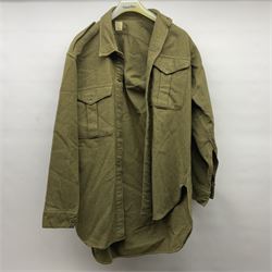 Two post-WWII British Army No.2 Dress tunics, one with Green Howards buttons; army shirt dated 1951; Royal Fleet Auxilliary jacket with trousers; three RAF/WAAF uniforms and RAF Greatcoat; and three canvas/webbing bags, two dated 1943 & 1945
