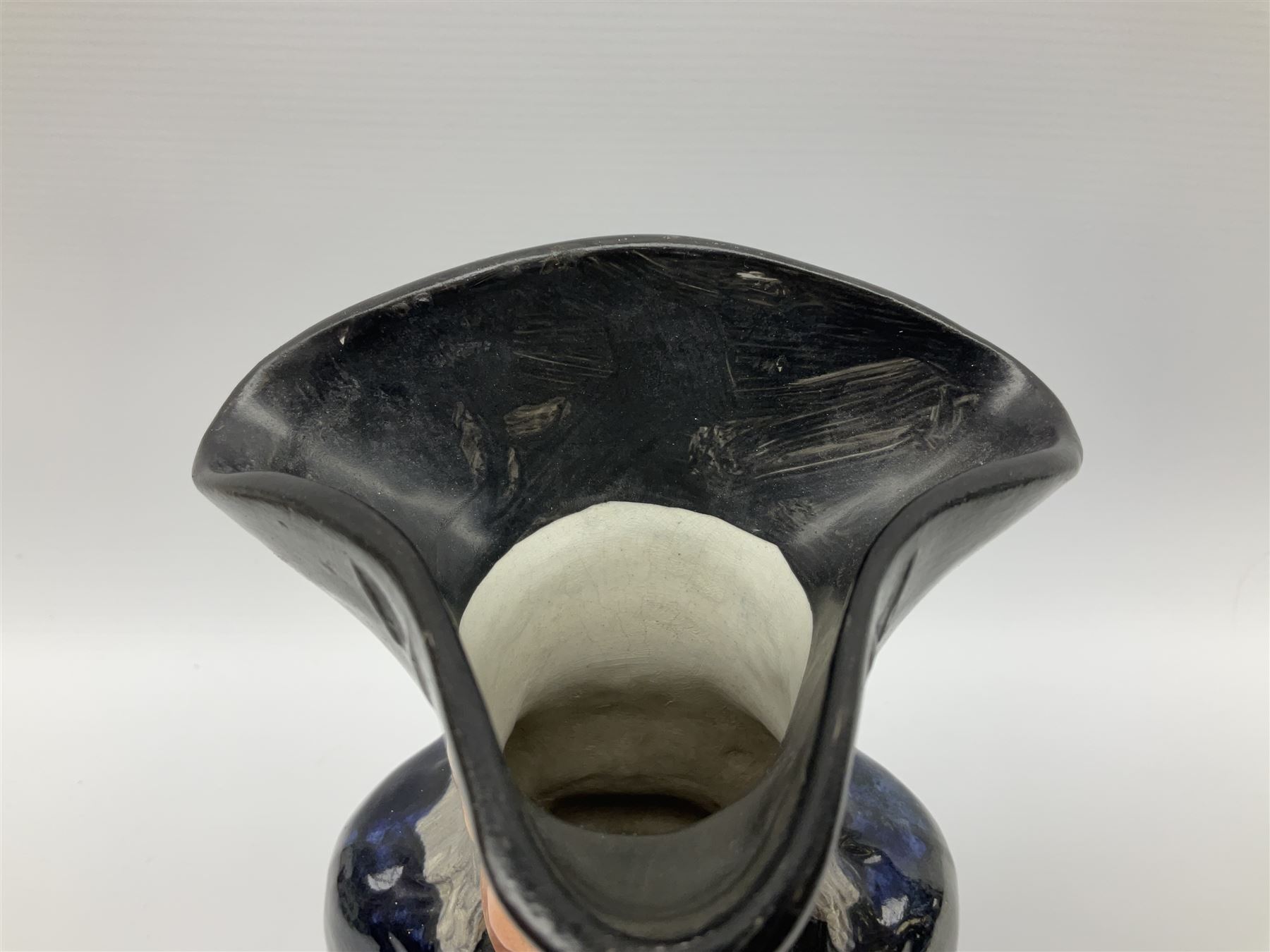 Early 20th century Staffordshire William Kent Squire toby jug, modelled seated upon a corner chair holding a jug of ale in his right hand, H28cm