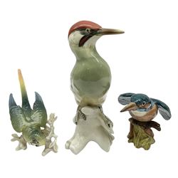Karl Ens figure of a green woodpecker, modelled perched upon branch, model no. 7527, together with Karl Ens figure of budgie and Beswick Kingfisher no. 2371, all with printed marks beneath, tallest H25cm