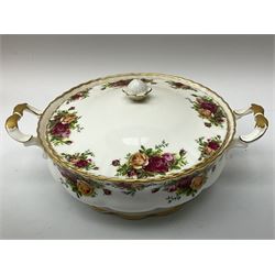 Royal Albert Old Country Roses part dinner and tea service comprising teapot, four tea cups and saucers, eight dessert plates, cake plate, cake stand, a tureen with cover, six dinner plates, an oval dish, two trinket dishes, bell and shoe decoration. 