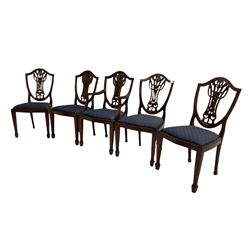 Set of five Georgian style mahogany dining chairs, pierced and carved backs, drop in seats upholstered in blue cover, on square tapering supports with spade feet