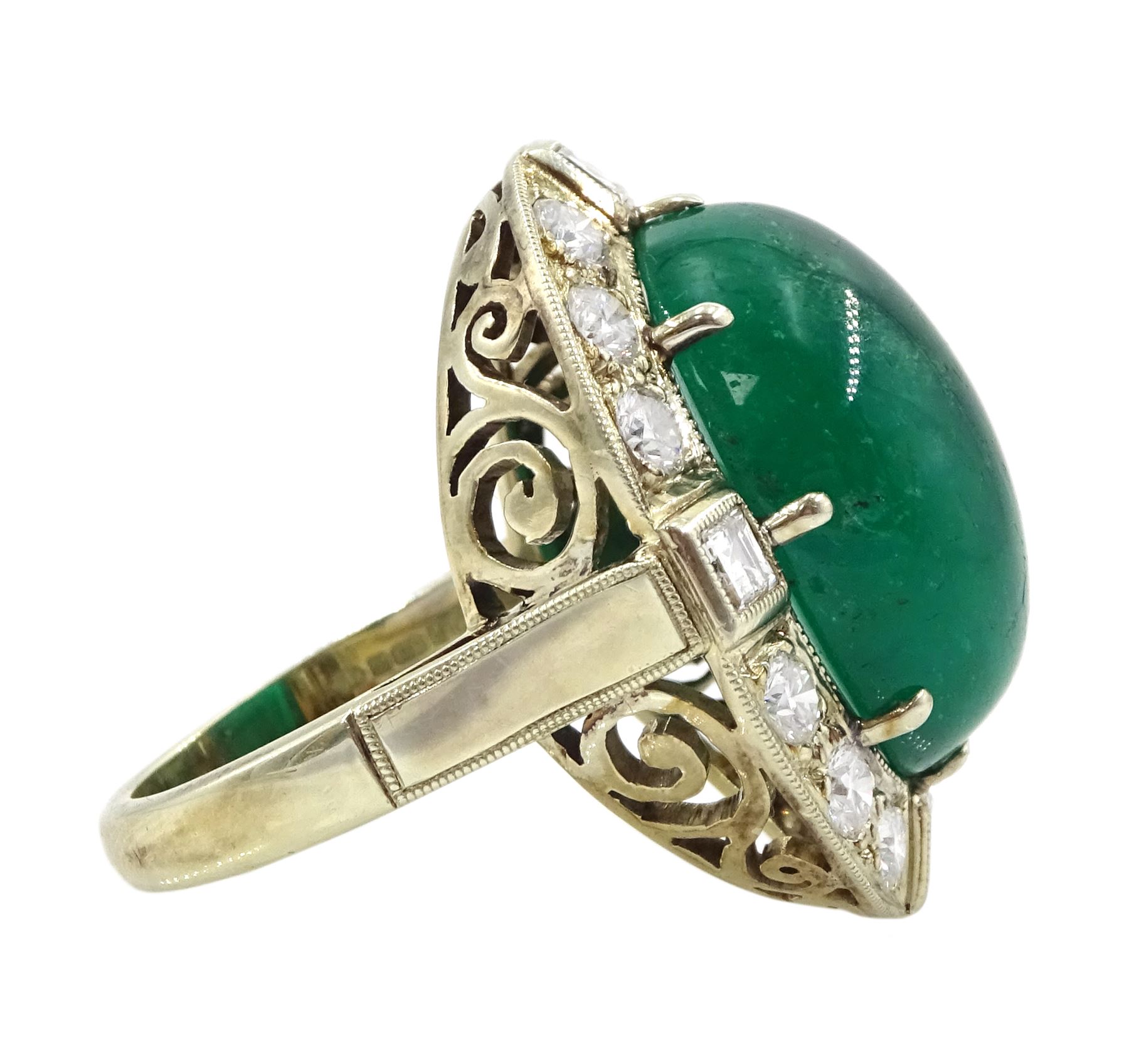 Gold emerald and diamond ring, the central oval cabochon emerald, with sixteen round and rectangular cut diamond halo surround by Judith Crowe, hallmarked 9ct, emerald 20.00 carat, total diamond weight 2.00 carat, with World Gemological Institute report