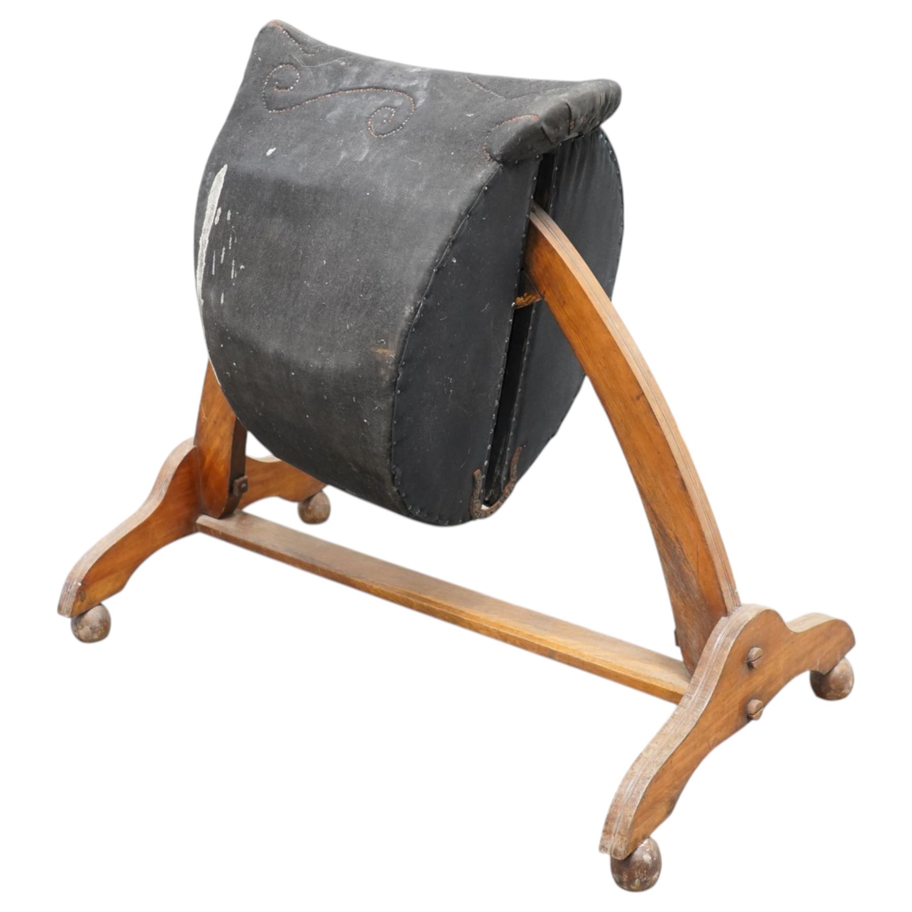 Carlton's - early 20th century weight bearing saddle stand, the top part allowing for the movement of the saddle, on curved oak trestle, marked Carlton's Registered