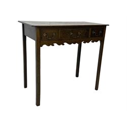 18th century oak lowboy, rectangular moulded top over three frieze drawers with brass swing handles, scalloped apron, on slender square section supports