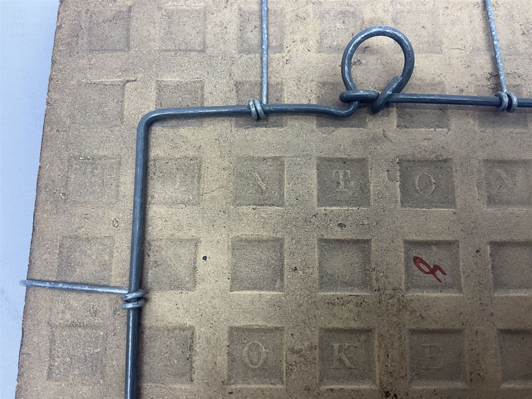 19th century Minton & Co majolica tile, decorated in relief with a bird upon a fruiting branch against a blue ground, with textured ochre border and anthemion to each corner, impressed mark verso, H19.7cm