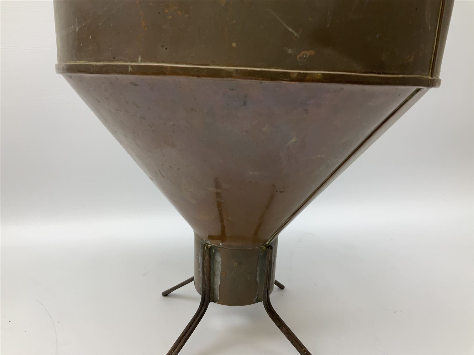Agricultural copper corn funnel, H32.5cm, another similar copper funnel and copper warming platter of oval form, with twin handles on four supports, with removeable warming plate, L49cm