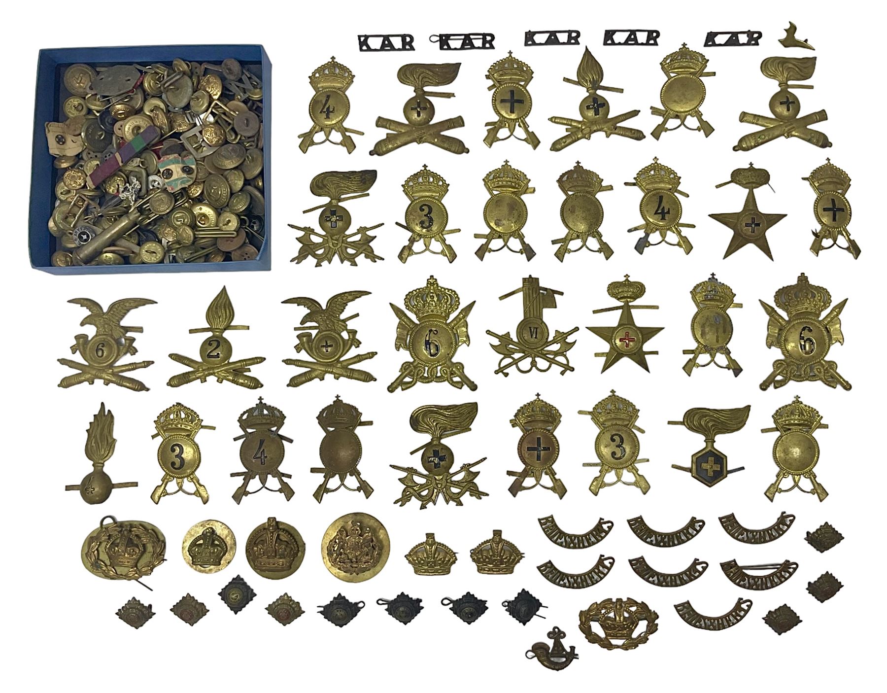 Over thirty British and Continental military metal badges; together with quantity of shoulder titles, collar dogs, rank pips, uniform buttons etc