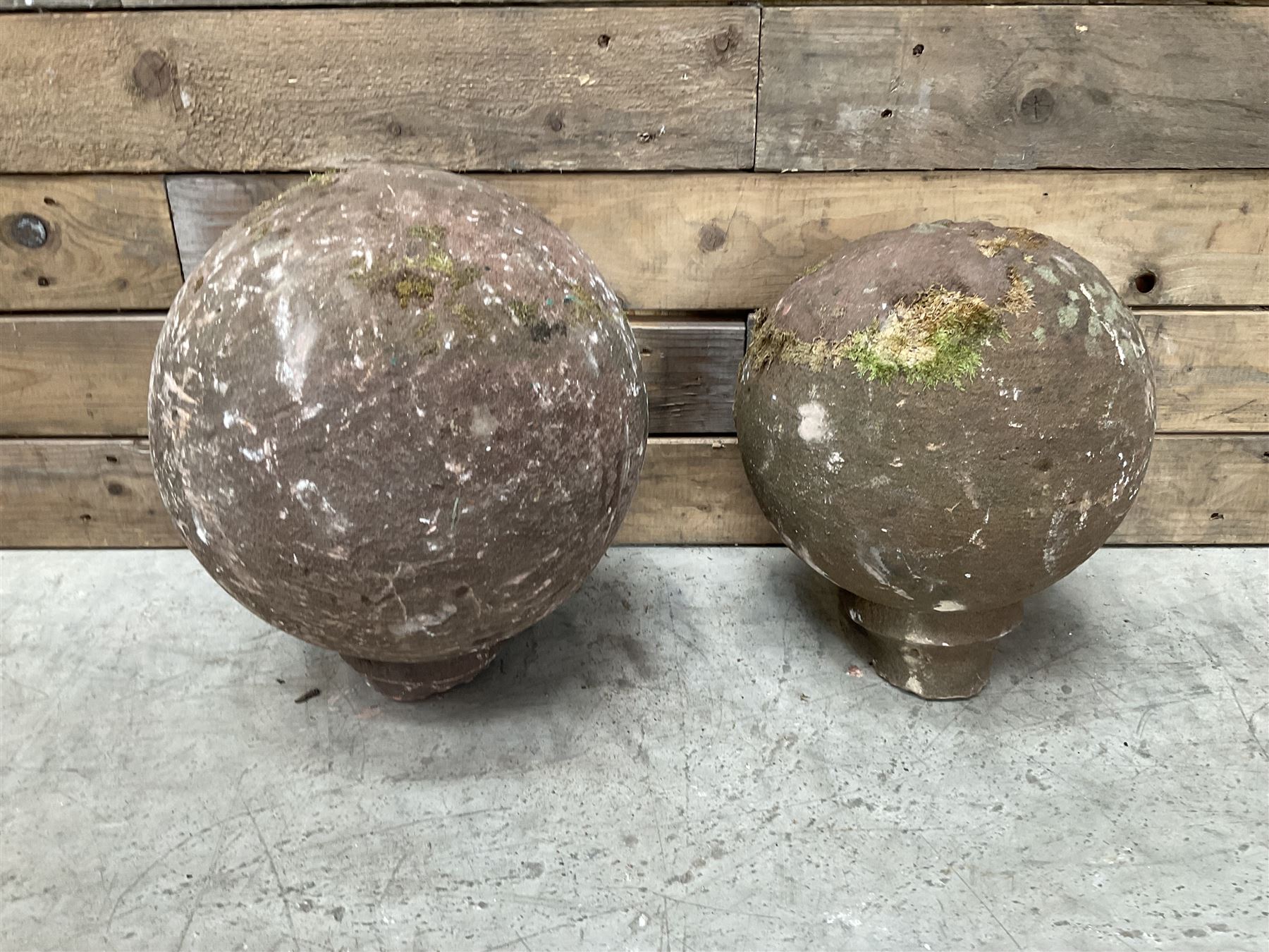 Two spherical stone gate post finials