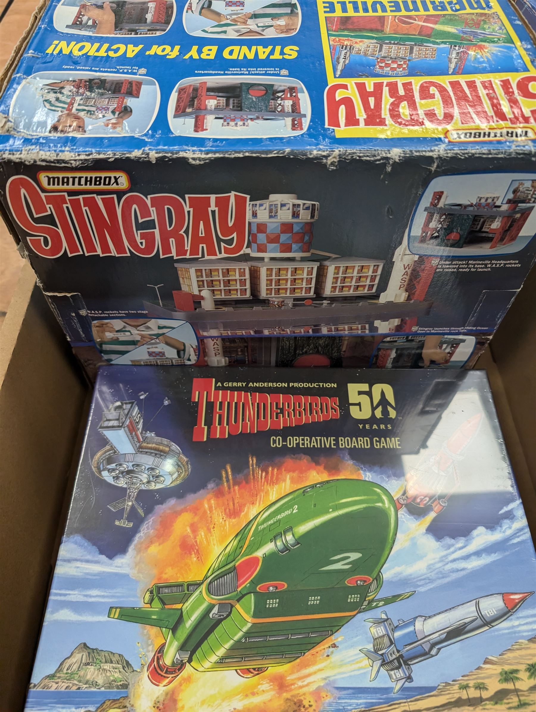 Gerry Anderson interest collectables and toys, including Carlton Thunderbirds Tracy Island, Matchbox Stingray Marineville Headquarters, both boxed, Matchbox carded Thunderbirds and Stingray figures and vehicles, Captain Scarlet and Joe90 collectables, etc