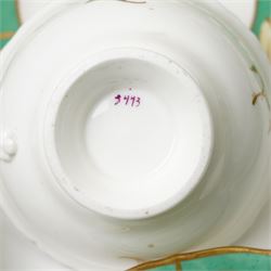 19th century porcelain tea service decorated with a border pattern of yellow leaves on a green ground comprising twelve cups and saucers, tea pot, sucrier and cover, milk jug, slop bowl and three plates, pattern number 5850
