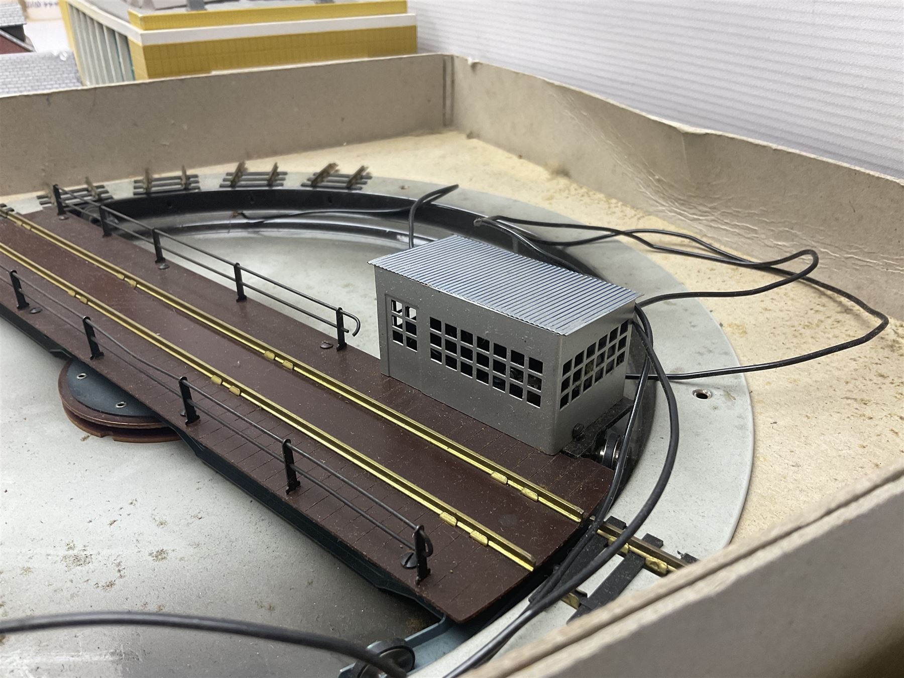 Fleischmann '00' gauge motorised turntable; boxed; kit-built plastic two-road engine shed; and eight kit-built card trackside/layout buildings