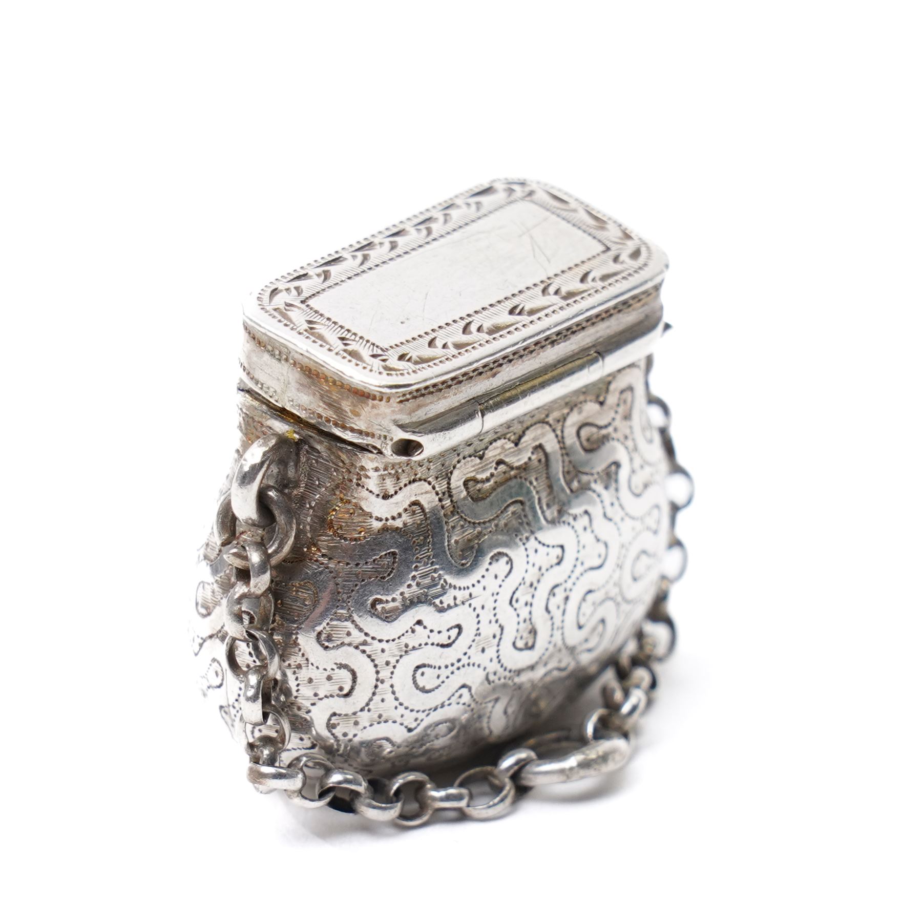 19th century silver vinaigrette modelled as a purse with engraved decoration and hinged grille, marks rubbed, Maker D & Co