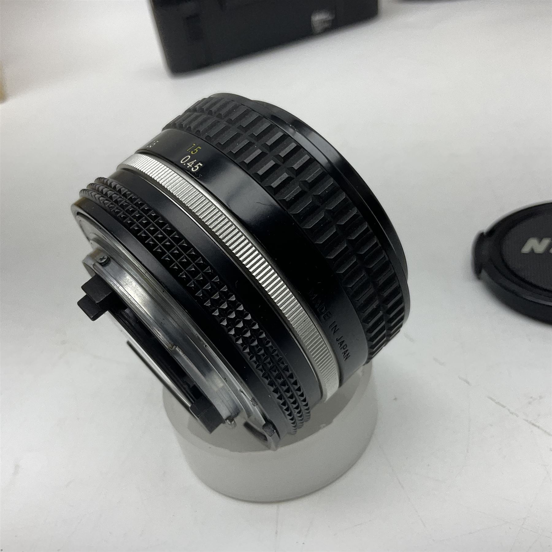 Nikon F3T camera body, in champagne/ titanium colourway, serial no. T8215031, with 'Nikon Nikkor 50mm 1:1.4' lens, Nikon MD4 motor drive, serial no. 156592 and Nikon MK-1 Firing range converter, all with original boxes 