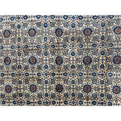 Northwestern Persian Tabriz hand-knotted carpet, the ivory ground with an all-over repeating Herati pattern of stylised palmettes, rosettes and serrated leaves in shades of indigo, terracotta and sky blue, framed by a dark blue border of arabesque vines and scrolling foliage between floral guard stripes, from the region of Tabriz