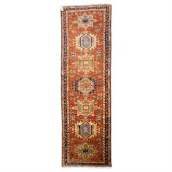 North West Persian Karajeh hand-knotted runner, field decorted with a series of linked ste...