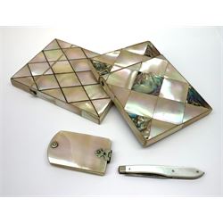 A 19th century mother of pearl visiting card case, of lozenge panel design, together with another similar mother of pearl and abalone shell example, a mother of pearl aide-mémoire, and a mother of pearl handled pick knife. (4). 