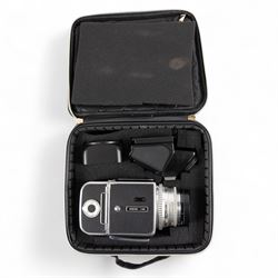 Hasselblad 500C medium format camera, serial no. TC60836, circa 1965, with Carl Zeiss Planar 1:2.8 f=80mm lens with cap, serial no. 4199654, one film back, serial no. TC87300 and a Hasselblad PM5 prism viewfinder serial no. 401EE1335