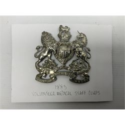 Victorian Volunteer Medical Staff Corps white metal helmet plate in the form of Victorian crowned Royal Arms with three part lower scroll for “VOLUNTEER MEDICAL STAFF CORPS”; three lug fittings to the reverse L8.5cm