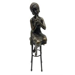 Art Deco style bronze figure of a lady seated on a stool applying lipstick, after Dimetri H Chiparus, with foundry mark, H28cm