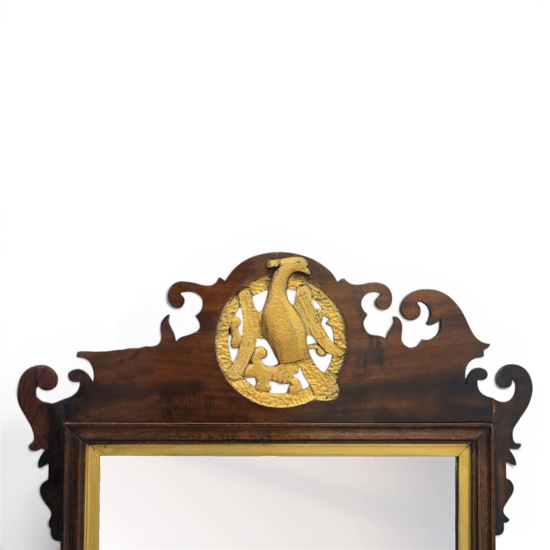 Late 19th century Chippendale style mahogany wall mirror, featuring gilded eagle pediment; together with a smaller similar mirror