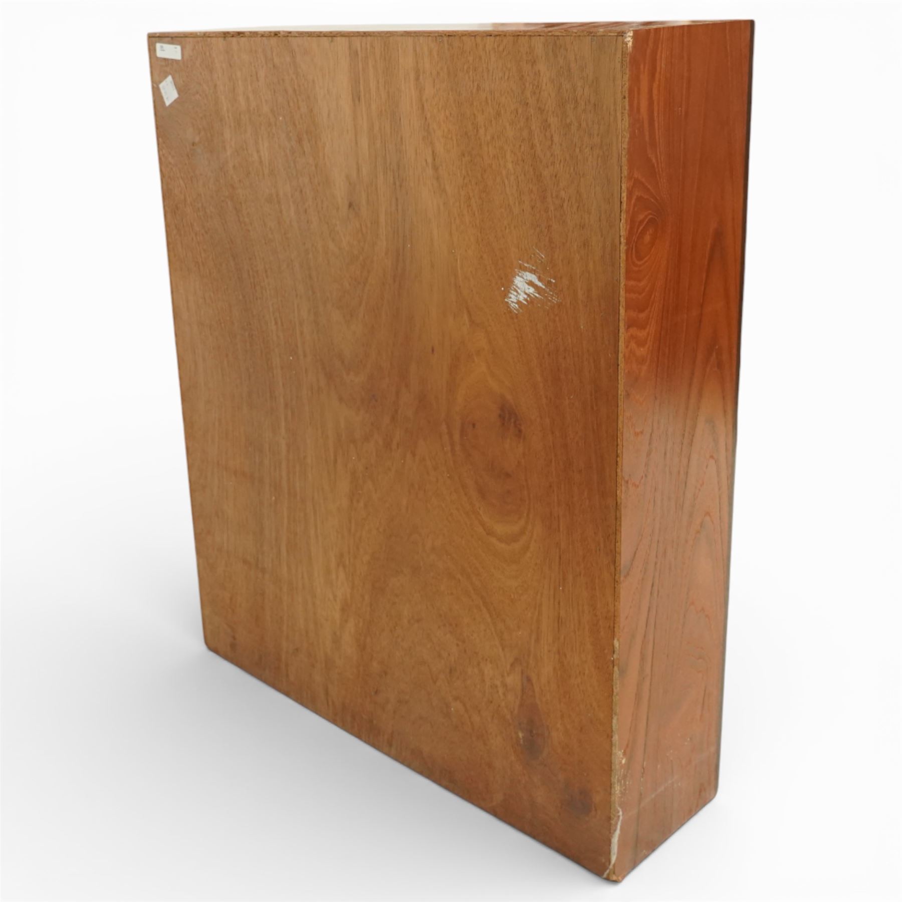 Mid 20th century teak bookcase, of rectangular form with plain top above three open shelves and a shaped plinth base